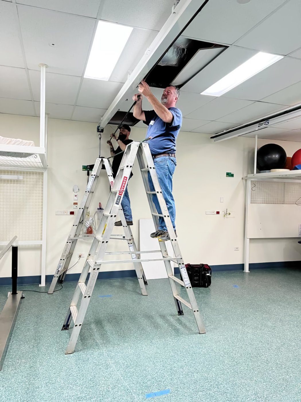 Aretech crew installing a ZeroG track