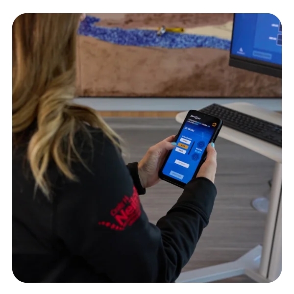 Clinician using the hand-held remote