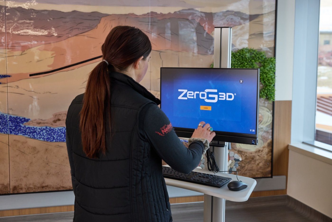 A clinician logging into the ZeroG 3D touchscreen computer